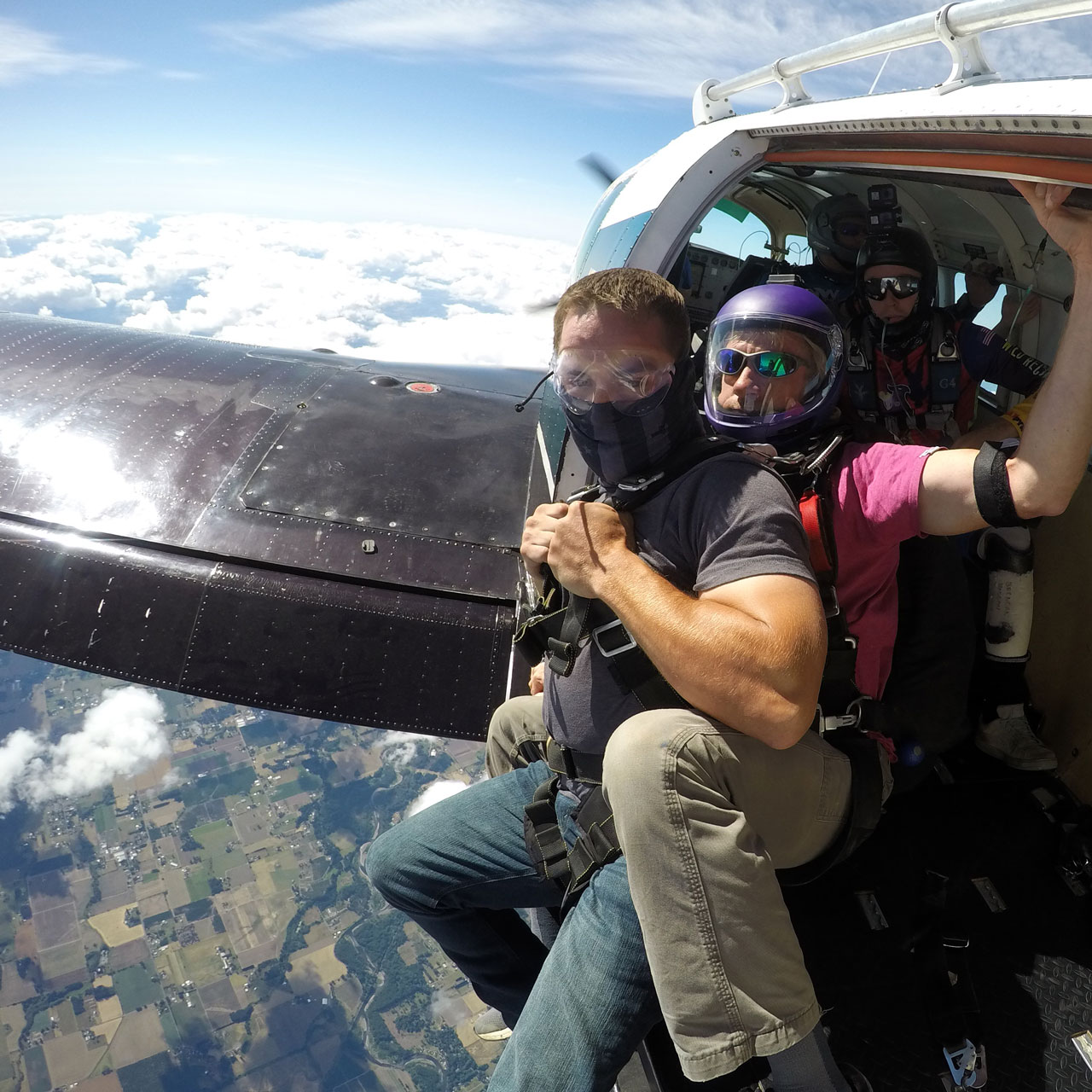 tandem skydiver about to exit aircraft